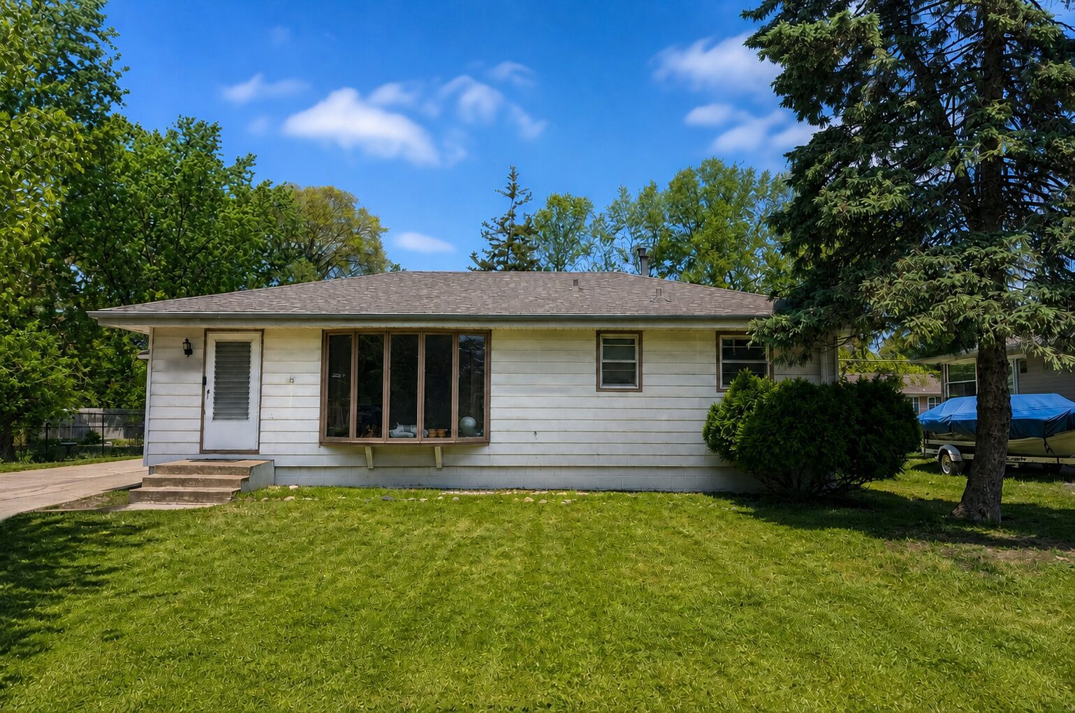 Front view of a New Hope home after GAF Timberline HDZ shingles and fascia work were completed on 45½ Avenue N
