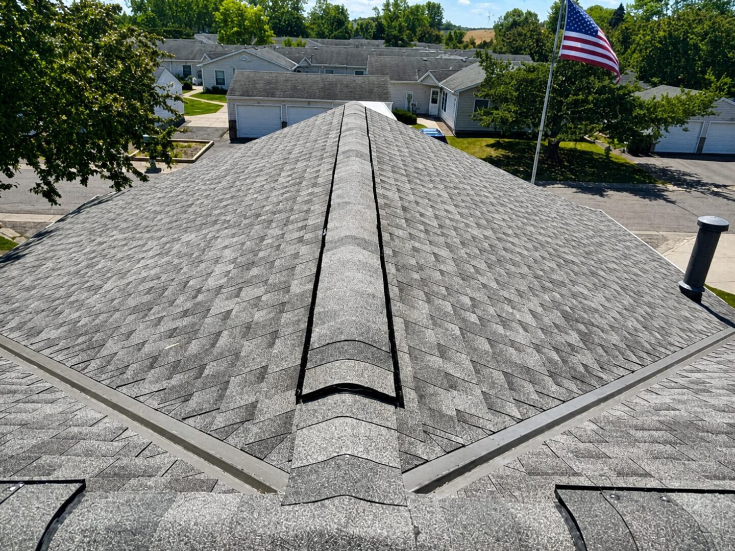Completed GAF Timberline HDZ shingles and ridge cap detail on Gettysburg Avenue North in Champlin, Minnesota
