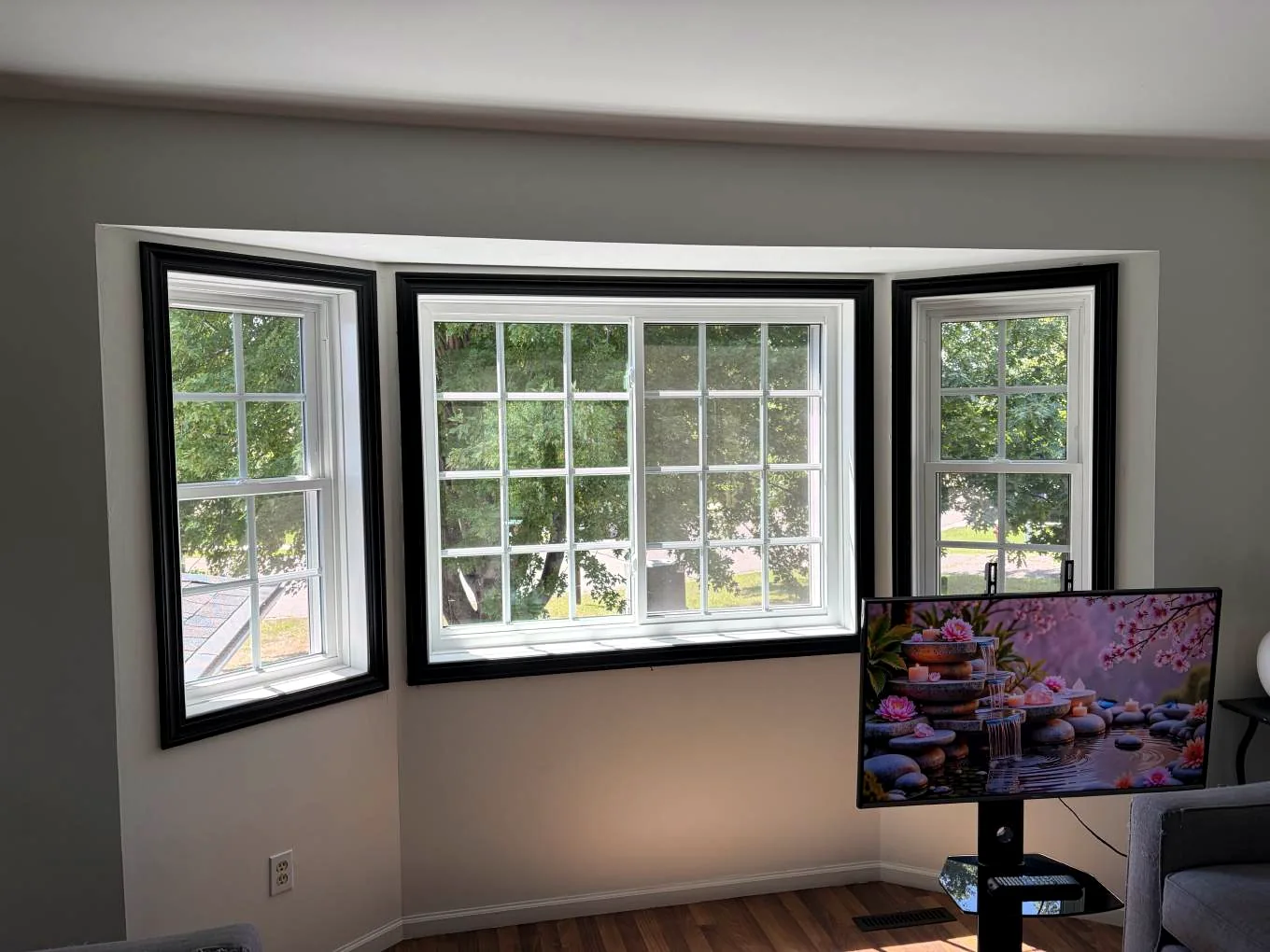 Interior view of a completed Alside Mezzo bay window with white vinyl frames on Kalland Avenue NE in Albertville, Minnesota