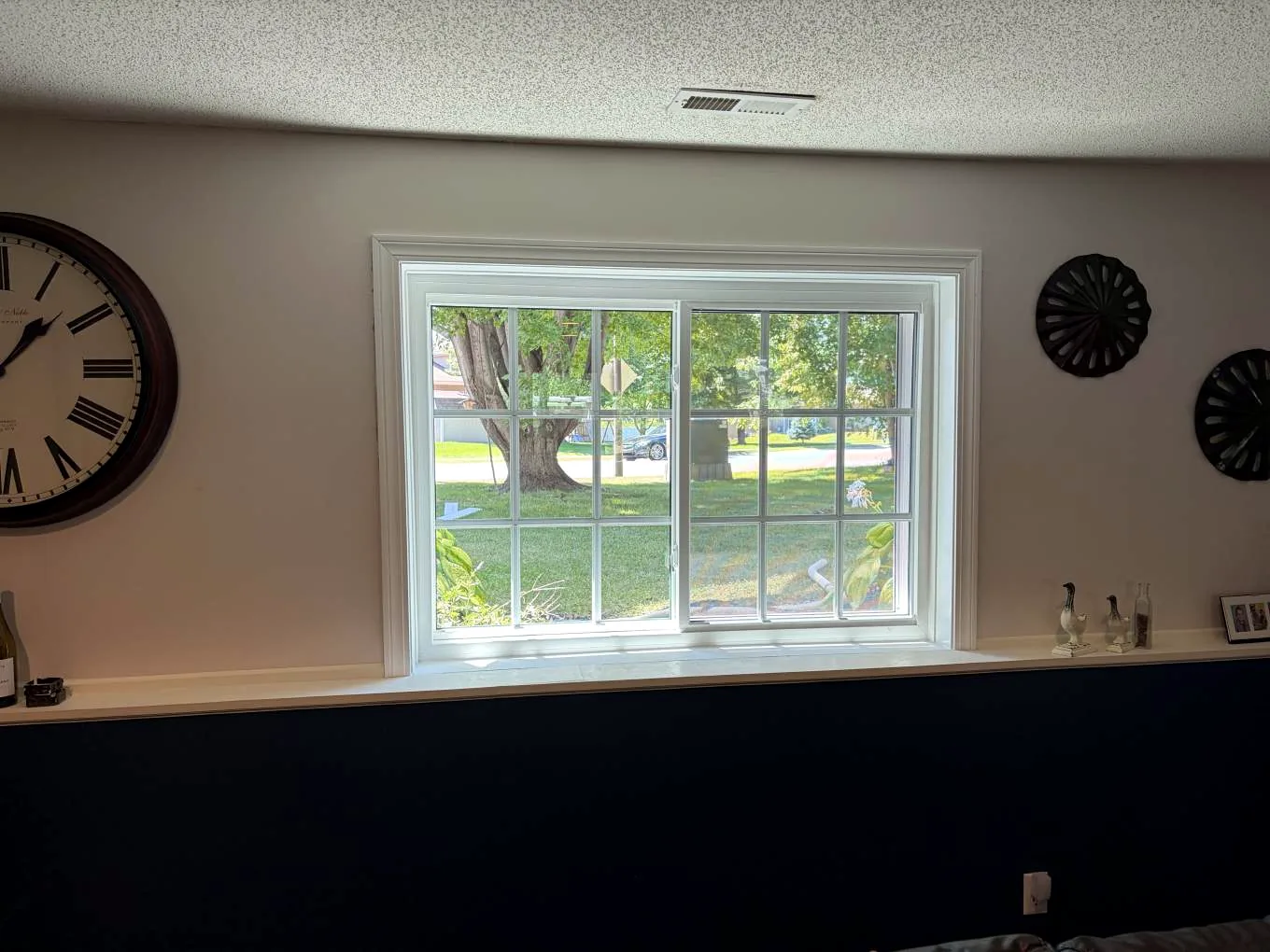 Interior view of a completed Alside Mezzo vinyl replacement window on Kalland Avenue NE in Albertville, Minnesota
