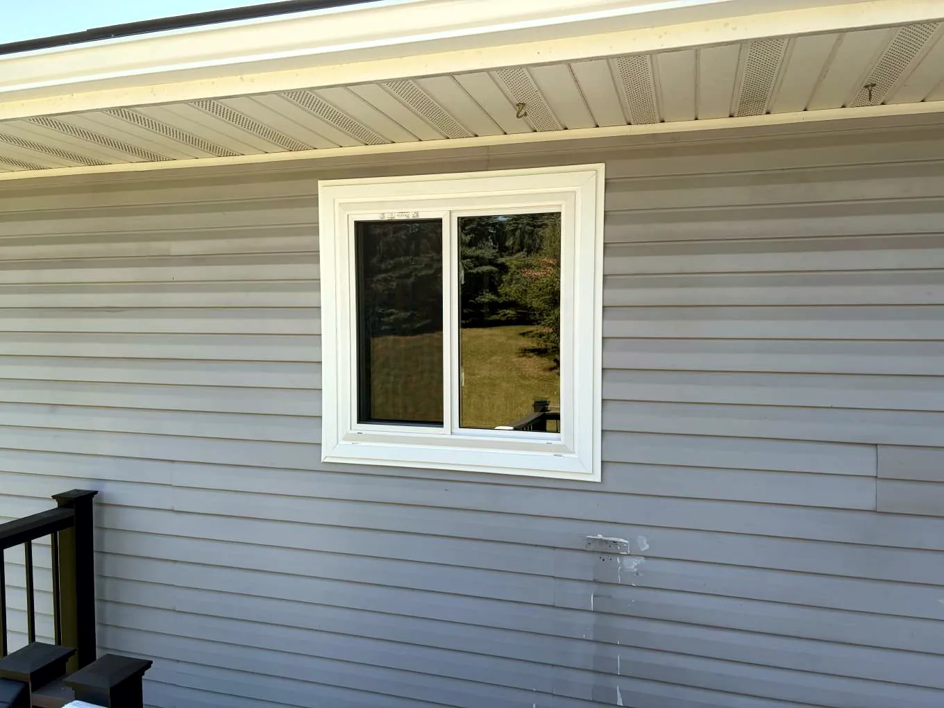 Exterior close-up of a completed Alside Mezzo replacement window on Kalland Avenue NE in Albertville, Minnesota