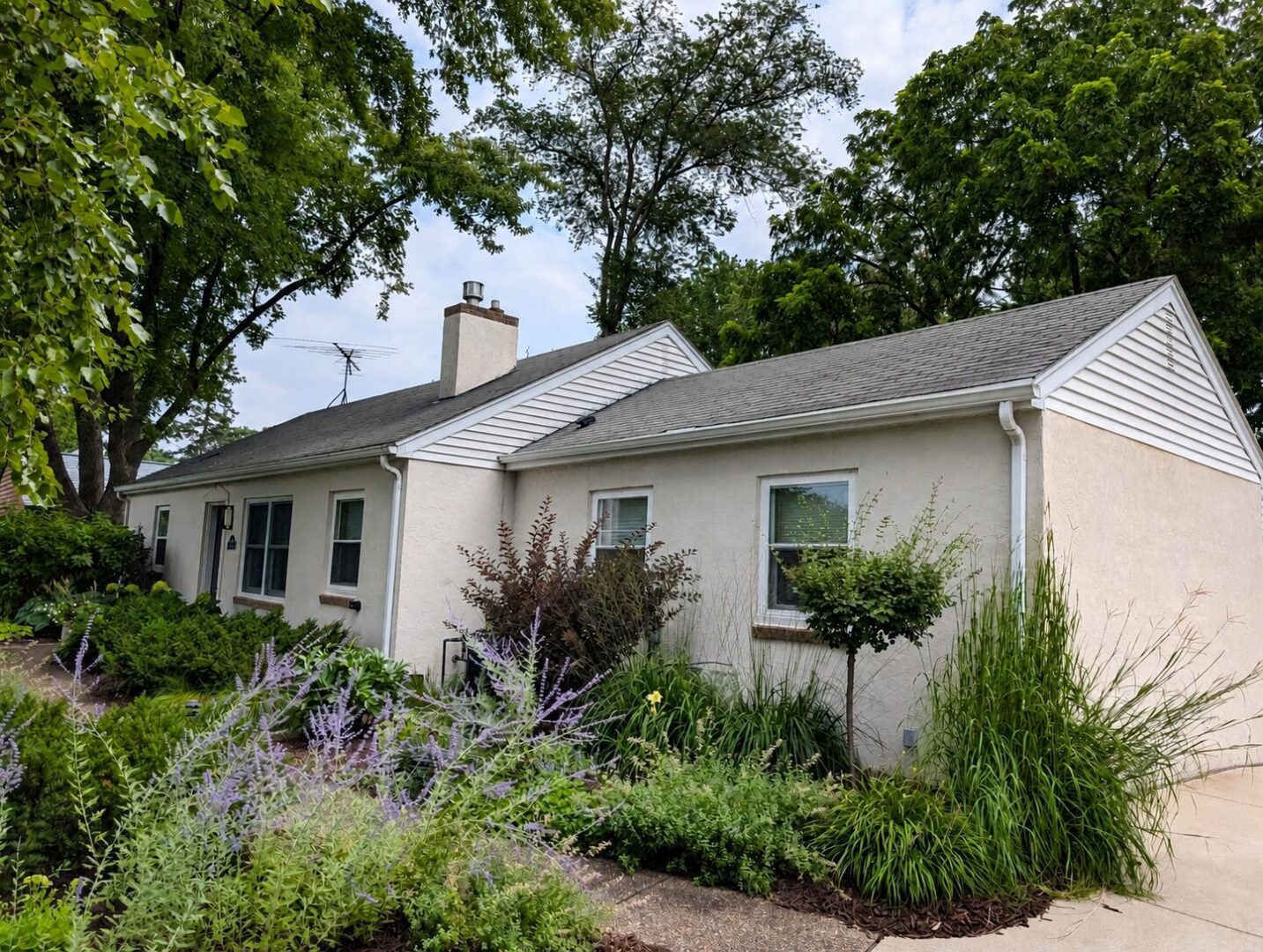 Aging asphalt shingle roof before replacement on Leroy Street in Wayzata, Minnesota