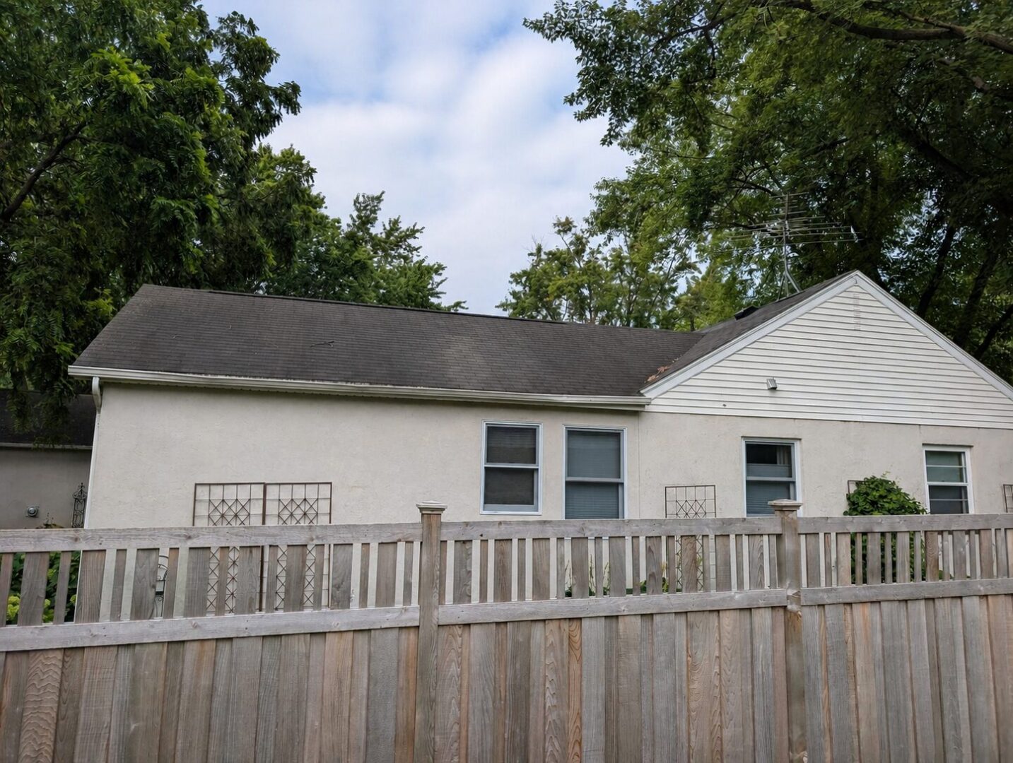 Worn asphalt shingles before roof replacement on a Leroy Street home in Wayzata, Minnesota