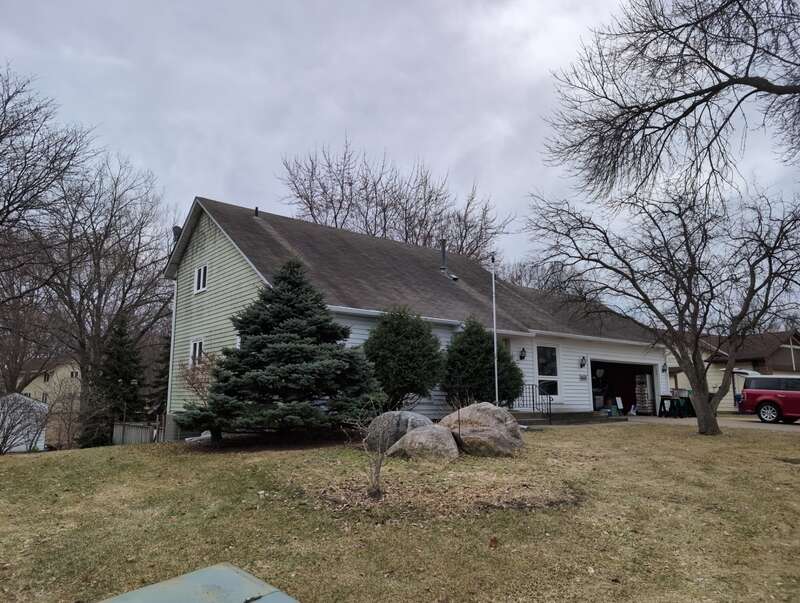 Before roof replacement on a home on Wellington Ln N in Maple Grove, Minnesota